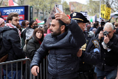 An Israeli Arab is escorted by police after an incident with pro-Palestinian protesters during a protest in solidarity with Pro-Palestinian organizers on the Columbia University campus, in New York City