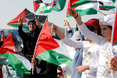 FILE PHOTO: Supporters of Jordanian Muslim Brotherhood and Islamic Action Front party hold Palestinian flags and shout slogans during a rally to mark the 70th anniversary of Nakba in the Jordan Valley, Sweimeh