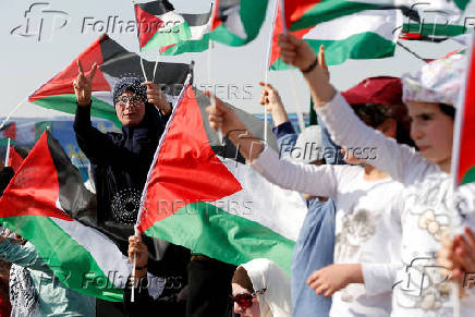 FILE PHOTO: Supporters of Jordanian Muslim Brotherhood and Islamic Action Front party hold Palestinian flags and shout slogans during a rally to mark the 70th anniversary of Nakba in the Jordan Valley, Sweimeh