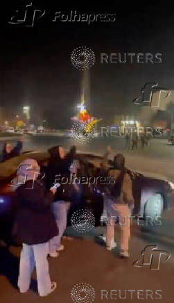 People celebrate at Umayyad Square in Damascus