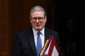 British Prime Minister Keir Starmer walks outside 10 Downing Street in London