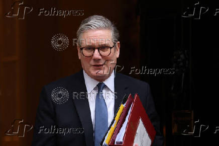 British Prime Minister Keir Starmer walks outside 10 Downing Street in London