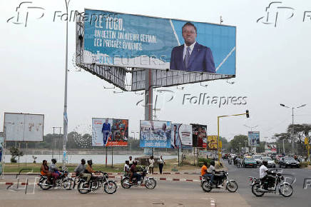 FILE PHOTO: A billboard of Gnassingbe is pictured on a street in Lome