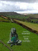 A drone view of a large-scale land art piece by local artists Sand In Your Eye of a girl holding the Earth for Earth Day in Hebden Bridge