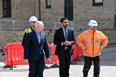 Scotland's First Minister Humza Yousaf visits a housing development in Dundee