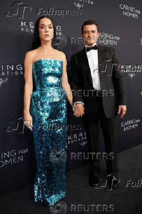 Katy Perry and Orlando Bloom arrive at the Kering Foundation's Caring for Women dinner in New York