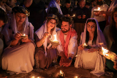 Iraqi Yazidis attend a ceremony on the occasion of Red Wednesday, to celebrate the Yazidi New Year, at Lalish temple in Shekhan District in Duhok province