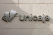 The new logo of Unicaja is seen on the facade of a Unicaja bank branch office in Malaga