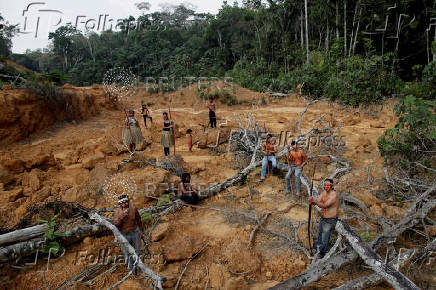 FILE PHOTO: Indigenous people from the Mura tribe shows a deforested area in unmarked indigenous lands inside the Amazon rainforest near Humaita