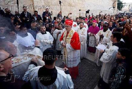 The Latin Patriarch of Jerusalem, Pierbattista Pizzaballa, leads a mass at the Church of Nativity in the Old City of Bethlehem