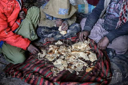 Afghans living in a camp amidst drop in temperatures in Kabul