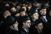 Mourners attend the funeral of Israeli rabbi, Zvi Kogan, in Kfar Habad