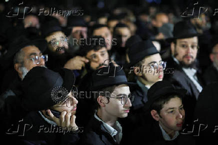 Mourners attend the funeral of Israeli rabbi, Zvi Kogan, in Kfar Habad