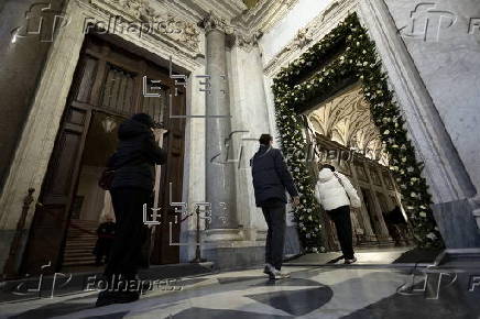 People walk through the Holy Door at Rome's Basilica of Saint Mary Major