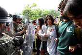 Law enforcement officers face off against pro-Palestinian protesters at the University of Texas