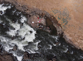 A drone view of people washing clothes at the Vaitarna river that provides water to Mumbai, in Kasara
