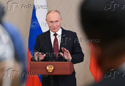 Russian President Putin attends a press conference in Astana