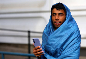 FILE PHOTO: Migrants pictured at the arrival center for asylum seekers at Berlin's Reinickendorf district