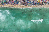 A drone view shows people enjoying the Macumba beach, during a heatwave in Rio de Janeiro