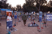 A woman visits the site of the Nova festival where party goers were killed and kidnapped during the October 7 attack by Hamas gunmen from Gaza