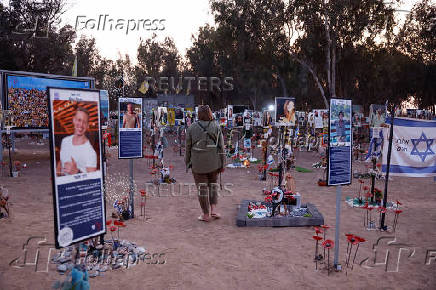 A woman visits the site of the Nova festival where party goers were killed and kidnapped during the October 7 attack by Hamas gunmen from Gaza