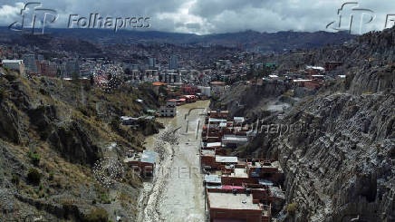 Drone picture shows flooded buildings in the aftermath of landslides caused by intense rains and illegal earth movements, in the Inca Llojeta area