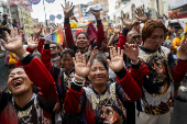 Filipino Catholics participate in the parade of Black Nazarene replicas