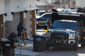 Investigators search a townhouse, in relation to the explosion in Las Vegas of a Tesla Cybertruck