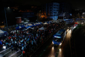 Pro-Yoon protesters are seen in the early light after rallying throughout the night in support of impeached South Korean President Yoon Suk Yeol near his official residence, in Seoul