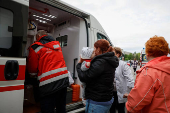 People evacuate hospital after authorities declare possible danger of Russian strike, in Kyiv