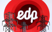 FILE PHOTO: Illustration shows Electric power transmission pylon miniatures and EDP Renovaveis logo