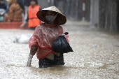 Red River overflows causing severe flooding in Hanoi following Typhoon Yagi