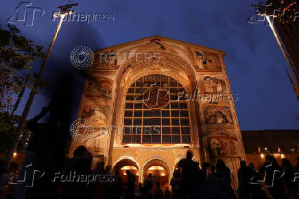 People pay homage to Brazil's patron saint at the Cathedral Basilica of the National Shrine of Our Lady Aparecida