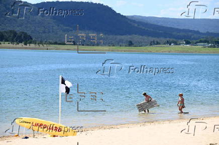 People find relief from the summer heat at Penrith Beach in Australia