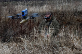 Ukrainian servicemen practice with an FPV drone, in Kharkiv region