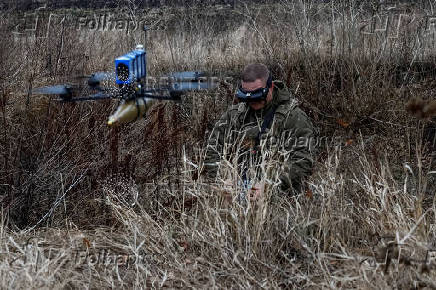 Ukrainian servicemen practice with an FPV drone, in Kharkiv region