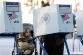 FILE PHOTO: Voters cast their ballot at a polling station during early voting in New York City