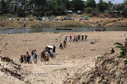 Myanmar's villagers flee to Thailand amid conflict of rebels with the military junta