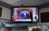 TV broadcasting shows a statement by Spain's Prime Minister Pedro Sanchez in a bar, in Ronda
