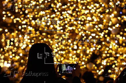 Paris Olympics chief Estanguet turns on Christmas lights on the Champs Elysees