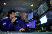 Traders work on the floor of the NYSE in New York