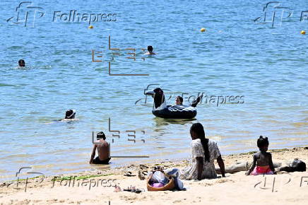 People find relief from the summer heat at Penrith Beach in Australia