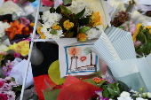 Floral tributes are left for victims of the attack at Westfield Bondi Junction shopping centre in Sydney on Saturday