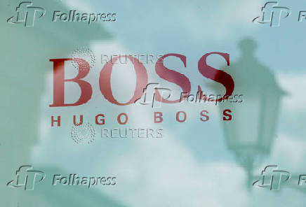FILE PHOTO: Hugo Boss store logo is seen on a shopping center at the outlet village Belaya Dacha outside Moscow