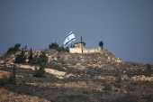 An Israeli flag flies in southern Lebanon, near the Israel-Lebanon border