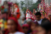 Catholics take part in a procession during the Palms and Flowers Festival in Panchimalco