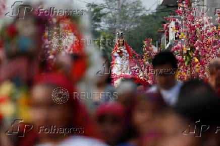 Catholics take part in a procession during the Palms and Flowers Festival in Panchimalco