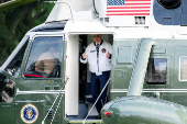 U.S. President Joe Biden wears the team USA Olympics jacket as he boards Marine One