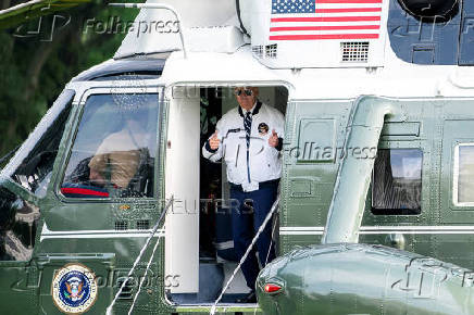 U.S. President Joe Biden wears the team USA Olympics jacket as he boards Marine One