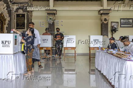 Voters cast their ballots in regional government elections in Indonesia